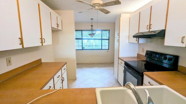 kitchen with pendant lighting, black electric range oven, and white cabinetry