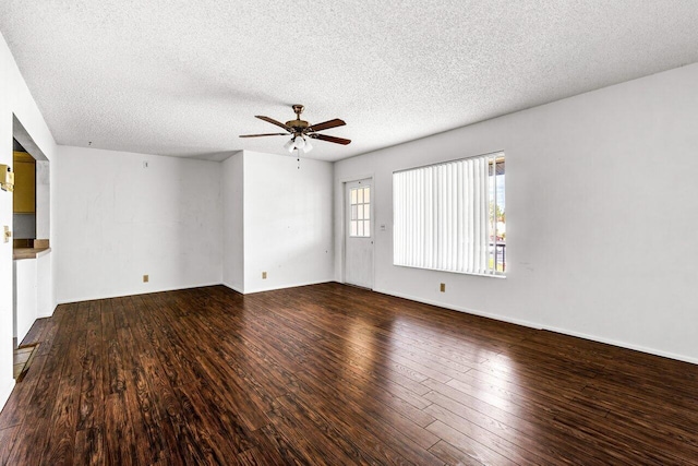 spare room featuring a textured ceiling, hardwood / wood-style flooring, and ceiling fan