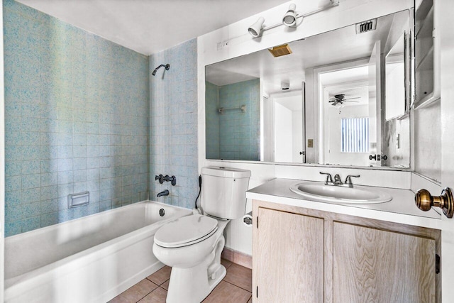 full bathroom featuring tile patterned floors, vanity, ceiling fan, toilet, and tiled shower / bath