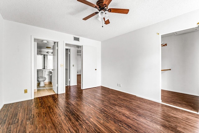 unfurnished bedroom with ensuite bath, ceiling fan, light hardwood / wood-style flooring, and a textured ceiling