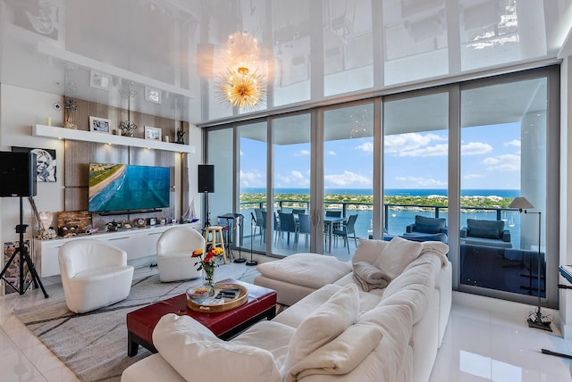 tiled living room featuring floor to ceiling windows, a water view, and a healthy amount of sunlight