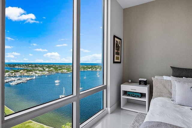 tiled bedroom with a water view