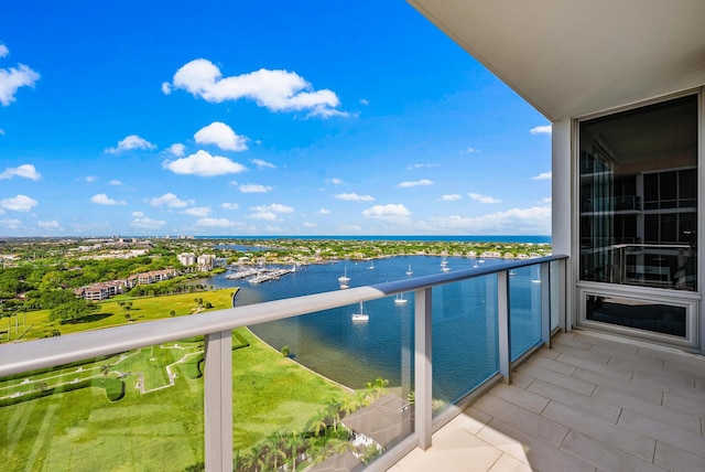 balcony featuring a water view