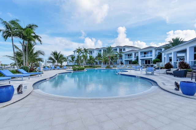 view of pool featuring an outdoor living space and a patio