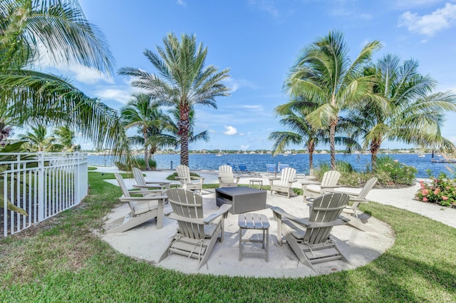 view of yard featuring a water view and a patio area