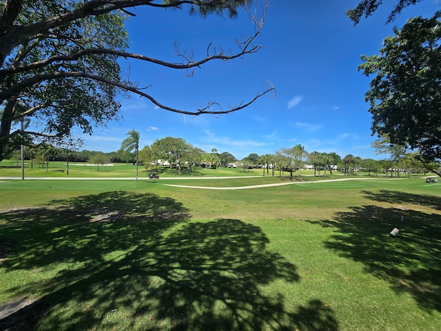 view of home's community featuring a lawn