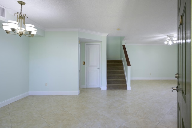 spare room featuring a textured ceiling, an inviting chandelier, crown molding, and light tile flooring