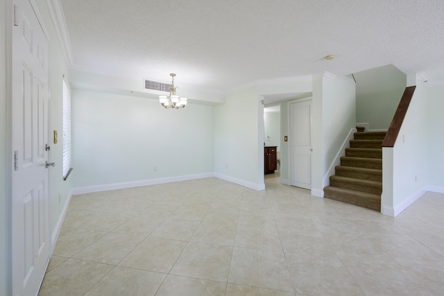 empty room with a notable chandelier, crown molding, and light tile floors