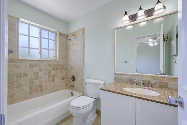 full bathroom featuring backsplash, ceiling fan, toilet, tiled shower / bath combo, and vanity