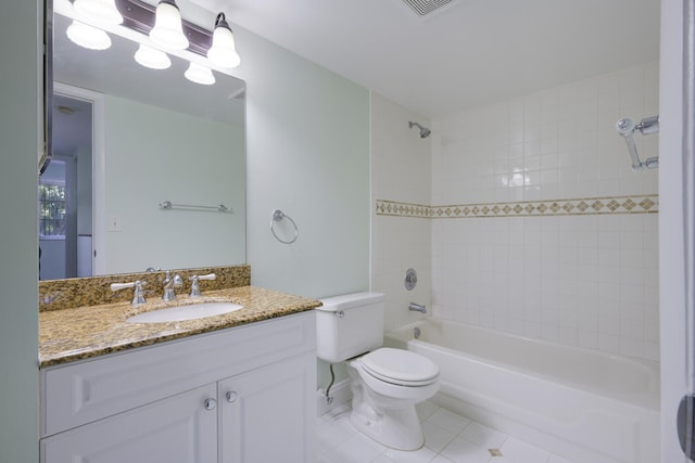 full bathroom with toilet, tile flooring, tiled shower / bath combo, and large vanity