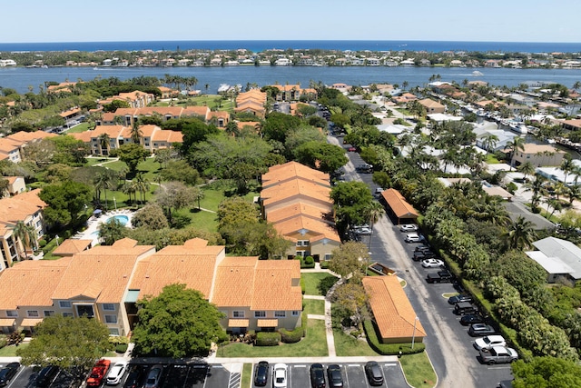 drone / aerial view with a water view