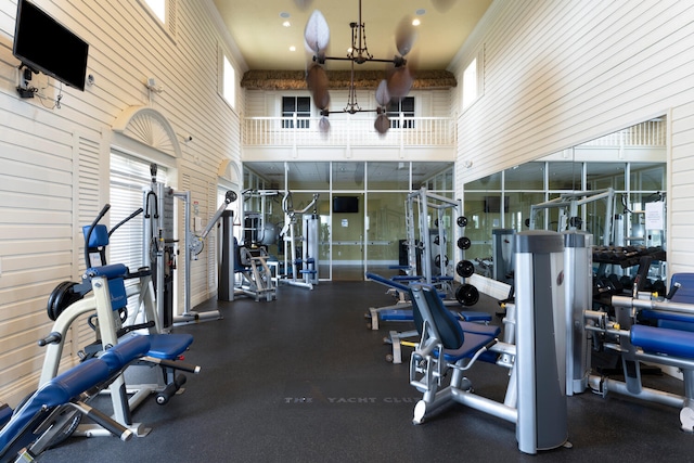 gym with a towering ceiling