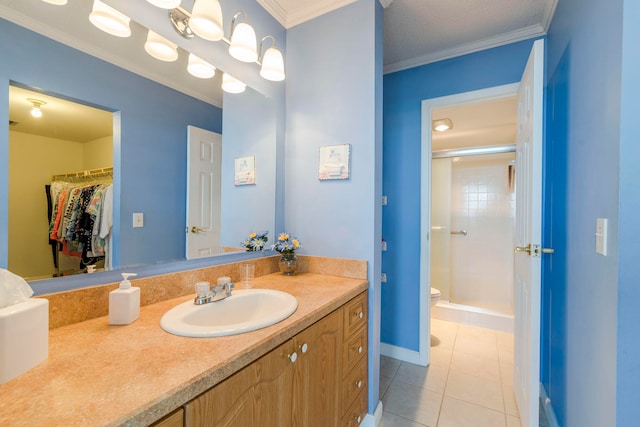 bathroom featuring crown molding, toilet, vanity, and tile flooring