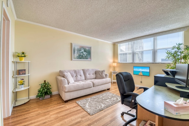 office area featuring a textured ceiling, light hardwood / wood-style floors, and ornamental molding