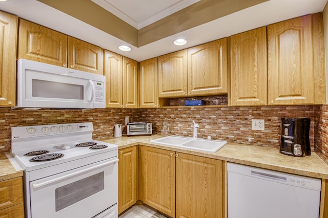 336 Golfview Rd Unit 1011, North Palm Beach, FL 33408 - kitchen with white appliances, a sink, crown molding, light countertops, and backsplash