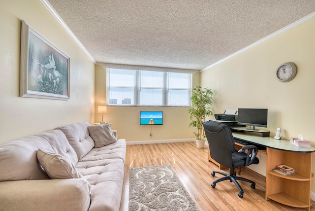 home office featuring a textured ceiling, light hardwood / wood-style floors, and ornamental molding