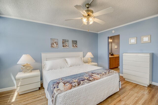 336 Golfview Rd Unit 1011, North Palm Beach, FL 33408 - bedroom featuring light wood finished floors, a textured ceiling, ornamental molding, baseboards, and ensuite bath