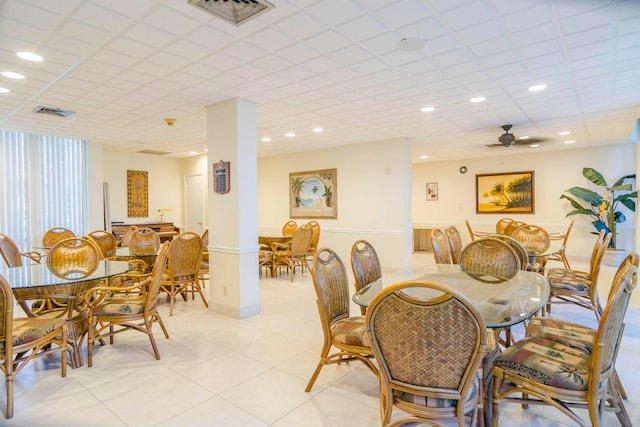 tiled dining area with ceiling fan