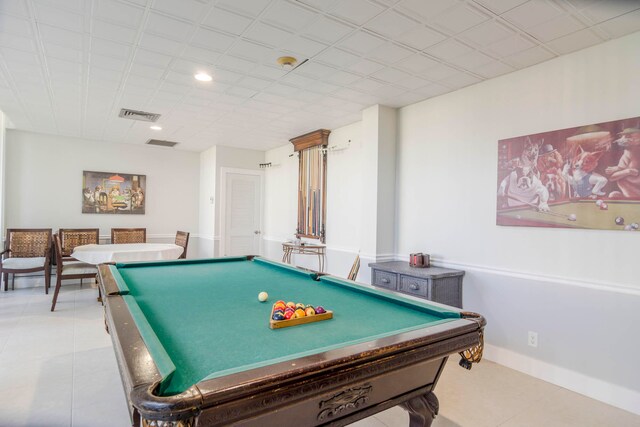 playroom featuring a paneled ceiling, pool table, and light tile flooring