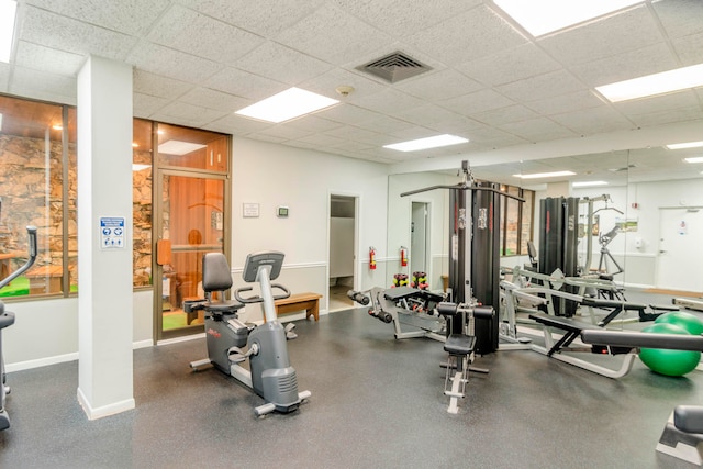 gym featuring a drop ceiling