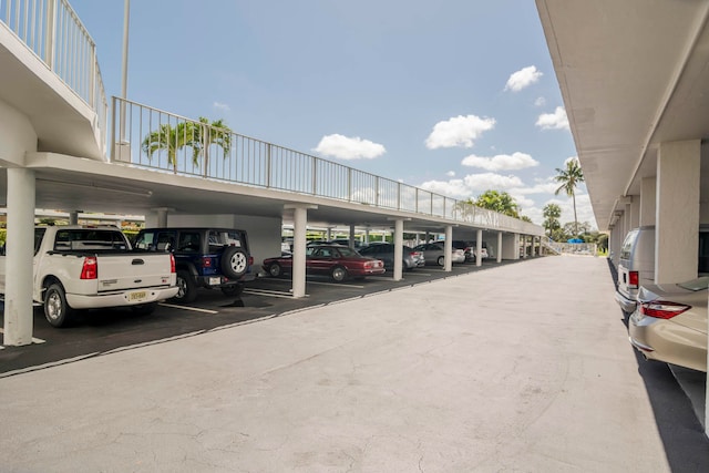 view of vehicle parking with a carport