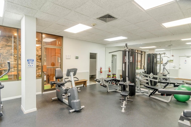 336 Golfview Rd Unit 1011, North Palm Beach, FL 33408 - exercise room with baseboards and a drop ceiling