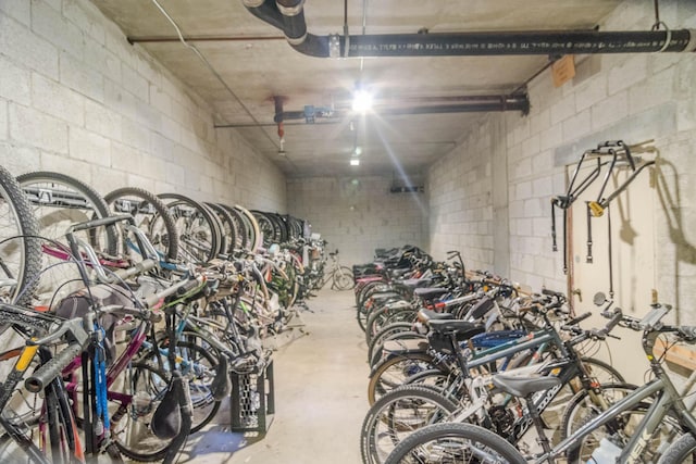 336 Golfview Rd Unit 1011, North Palm Beach, FL 33408 - garage featuring bike storage and concrete block wall