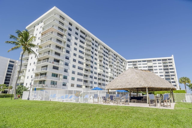 336 Golfview Rd Unit 1011, North Palm Beach, FL 33408 - view of apartment building / complex featuring fence