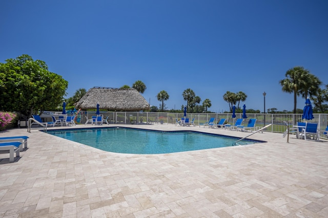 336 Golfview Rd Unit 1011, North Palm Beach, FL 33408 - community pool with fence and a patio