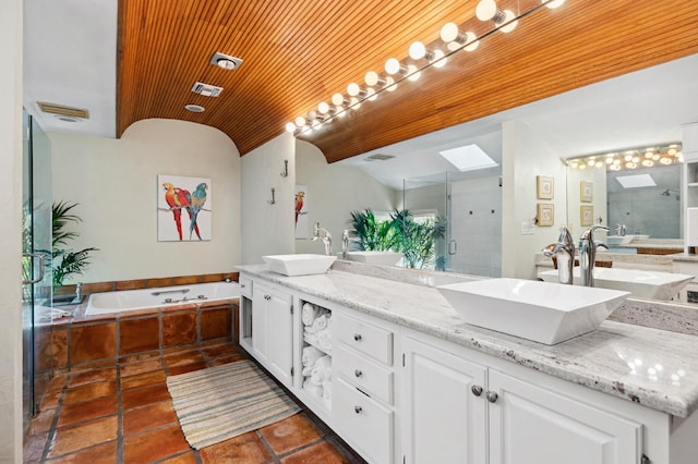 bathroom with double sink, tiled bath, tile flooring, vanity with extensive cabinet space, and wooden ceiling