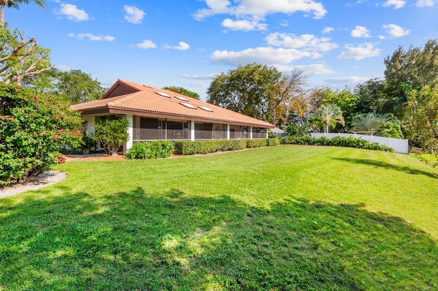 view of yard featuring a sunroom