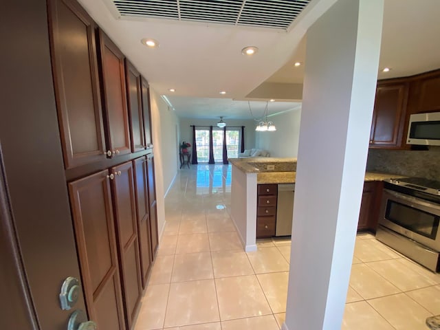 interior space with an inviting chandelier and light tile flooring