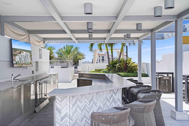 view of patio / terrace featuring a wet bar