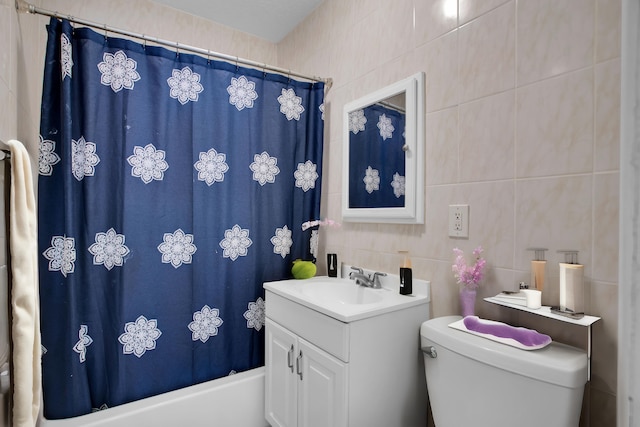 full bathroom with oversized vanity, tile walls, shower / bath combo, and toilet