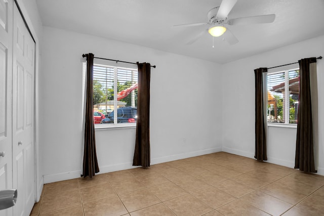 interior space with ceiling fan and a wealth of natural light