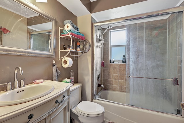 full bathroom featuring vanity, toilet, and enclosed tub / shower combo