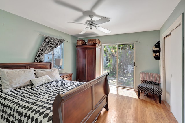 bedroom featuring access to exterior, a closet, light hardwood / wood-style floors, and ceiling fan