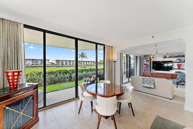 dining area featuring a wall of windows and light tile patterned floors