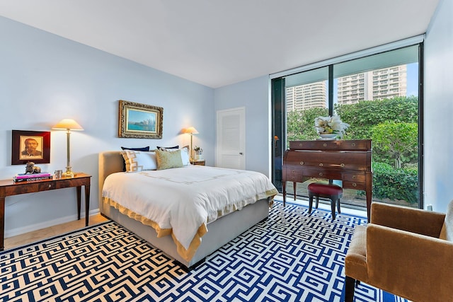 bedroom featuring expansive windows