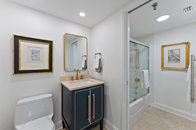 full bathroom with vanity, tile patterned flooring, combined bath / shower with glass door, and toilet