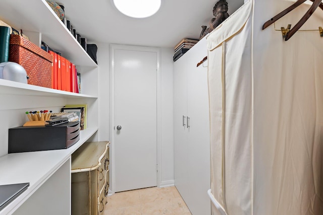 spacious closet featuring light tile patterned flooring