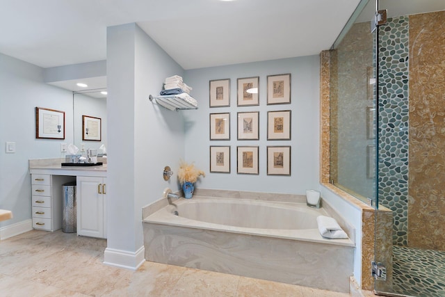 bathroom featuring vanity and separate shower and tub