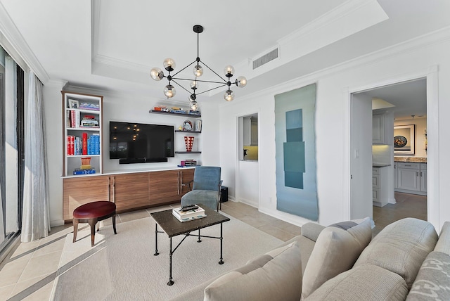 tiled living room with crown molding, a raised ceiling, and a chandelier