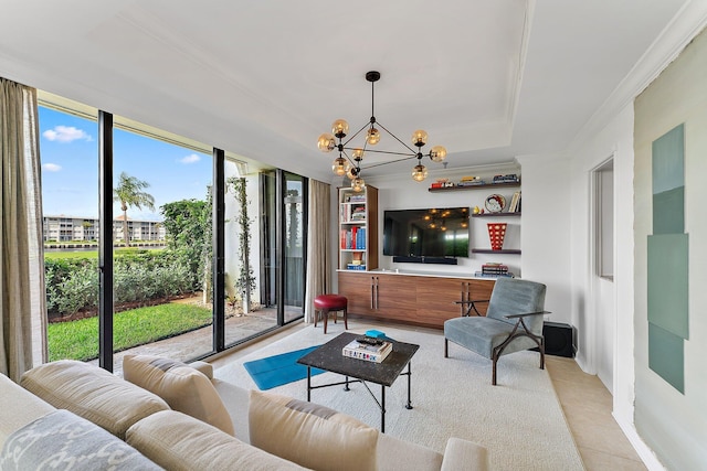 living room featuring an inviting chandelier, crown molding, and a wall of windows