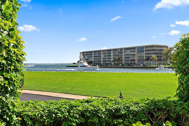 exterior space with a water view and a yard