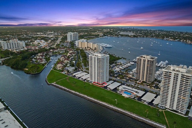 aerial view at dusk with a water view