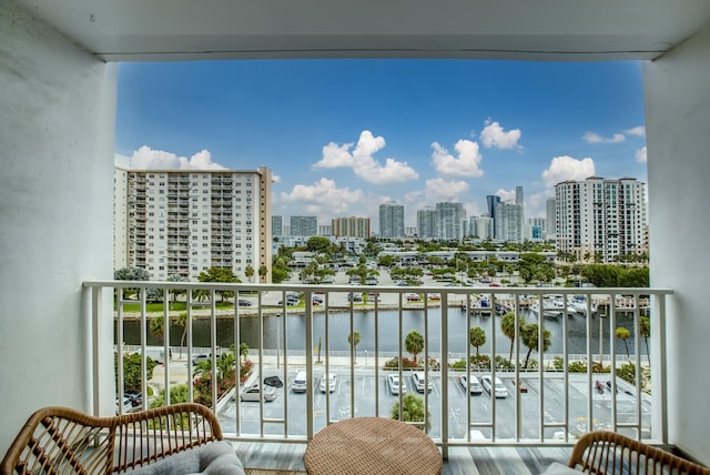 balcony featuring a water view