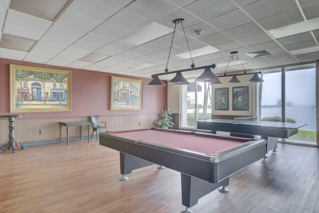 rec room featuring billiards, a drop ceiling, and light hardwood / wood-style flooring