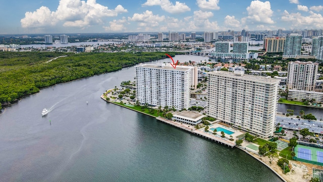 birds eye view of property with a water view