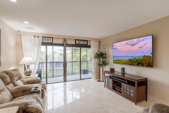 living room featuring a textured ceiling and light tile flooring